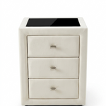 White nightstand with three drawers on a white background